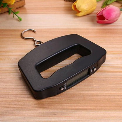 balance à bagage avec crochet sur table